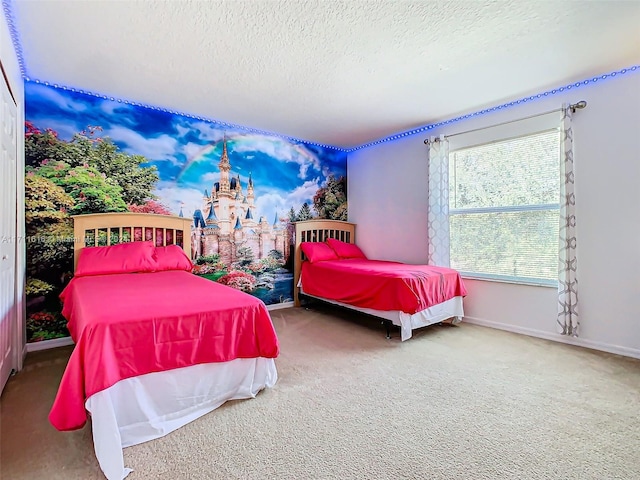 carpeted bedroom featuring a textured ceiling