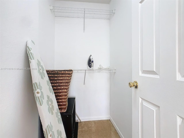 spacious closet with carpet flooring