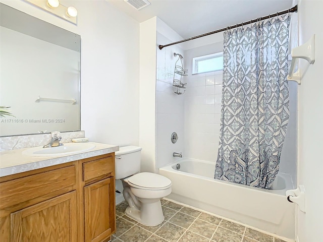 full bathroom featuring tile patterned flooring, shower / tub combo, vanity, and toilet