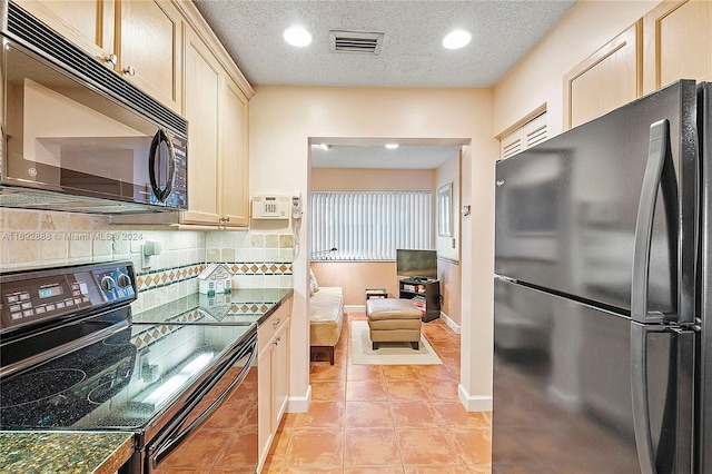 kitchen with tasteful backsplash, a textured ceiling, black appliances, light brown cabinets, and light tile patterned flooring