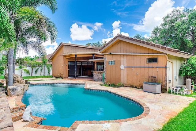 view of swimming pool with a patio area