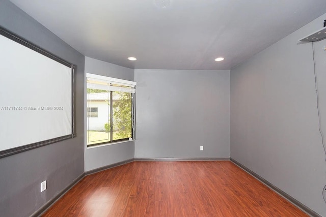 spare room featuring hardwood / wood-style floors