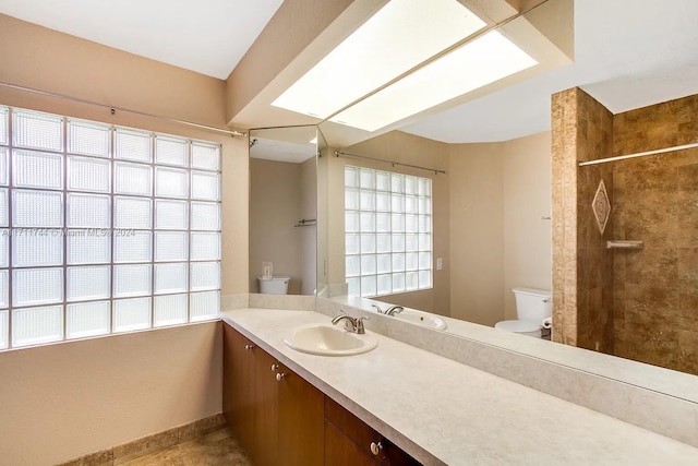 bathroom featuring tiled shower, tile patterned floors, vanity, and toilet