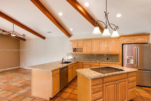 kitchen featuring stainless steel appliances, a kitchen island, tasteful backsplash, and sink