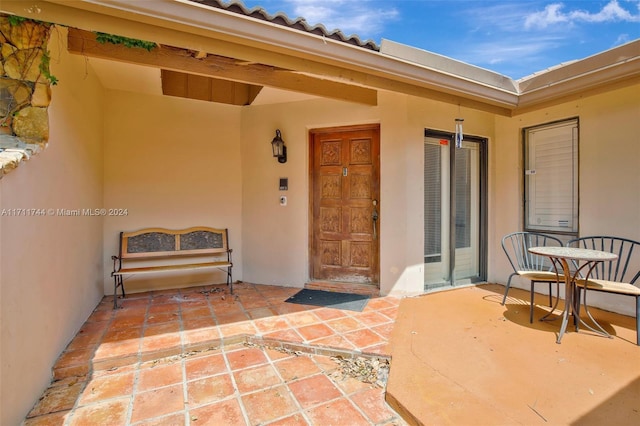 doorway to property featuring a patio