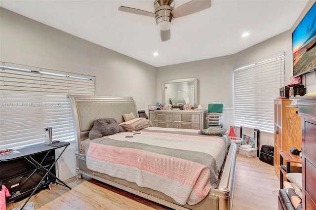 bedroom with ceiling fan and light hardwood / wood-style floors