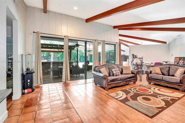 living room featuring beam ceiling and light hardwood / wood-style floors