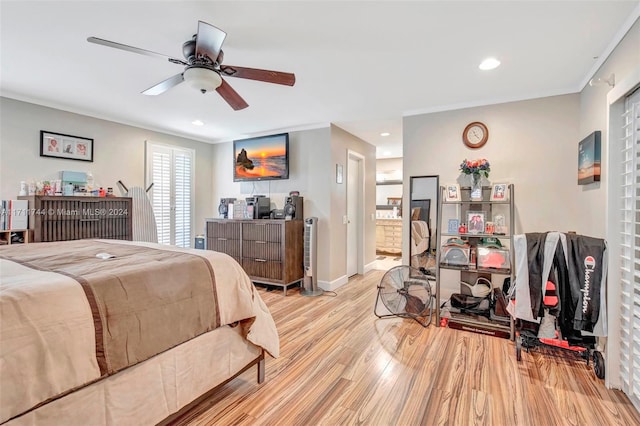 bedroom featuring ceiling fan and light hardwood / wood-style flooring