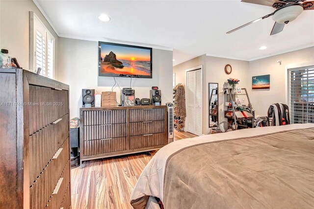 bedroom featuring ceiling fan, light wood-type flooring, ornamental molding, and access to outside