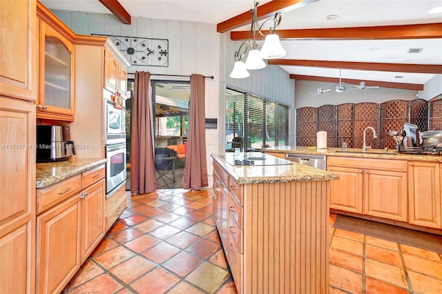 kitchen with light stone countertops, sink, a center island, vaulted ceiling with beams, and appliances with stainless steel finishes