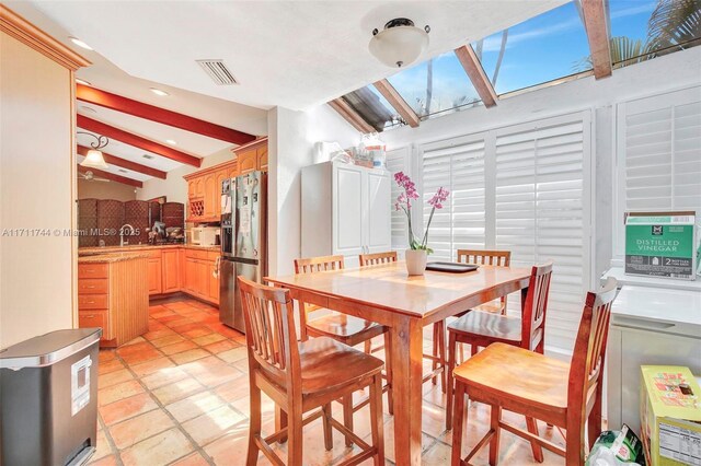 dining area with vaulted ceiling