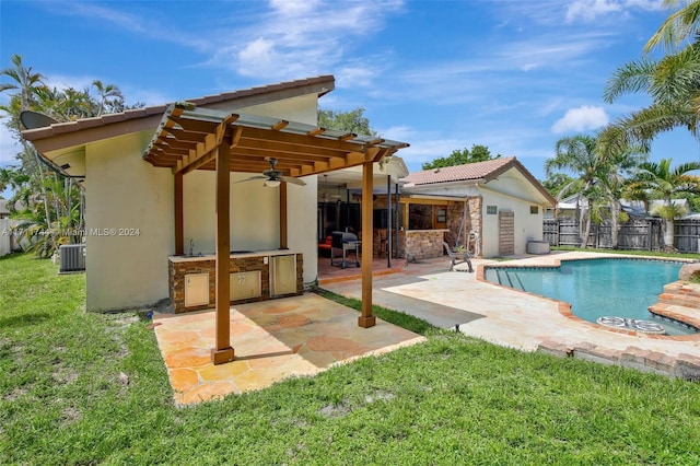 view of pool with area for grilling, ceiling fan, central AC unit, a patio, and a lawn