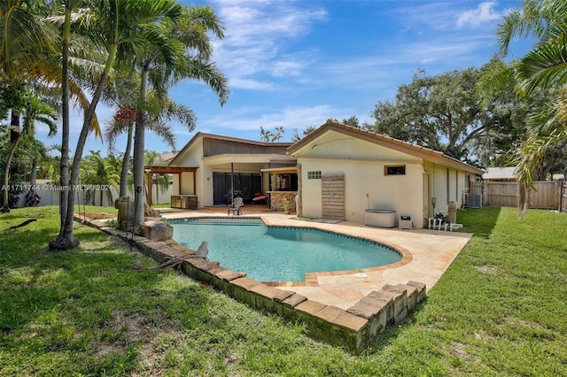 view of swimming pool featuring a lawn, cooling unit, and a patio