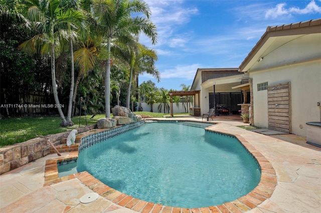 view of swimming pool featuring a patio area