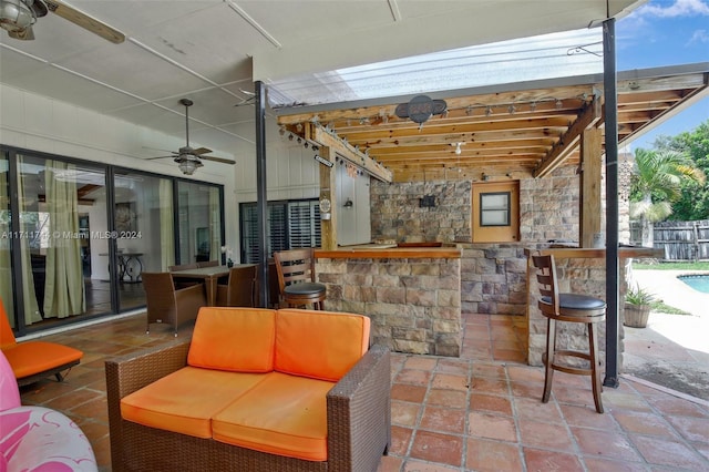 view of patio featuring ceiling fan