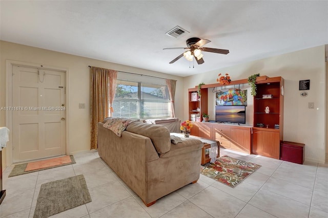 living room with ceiling fan and light tile patterned floors