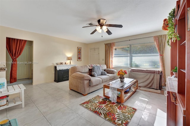 tiled living room with ceiling fan