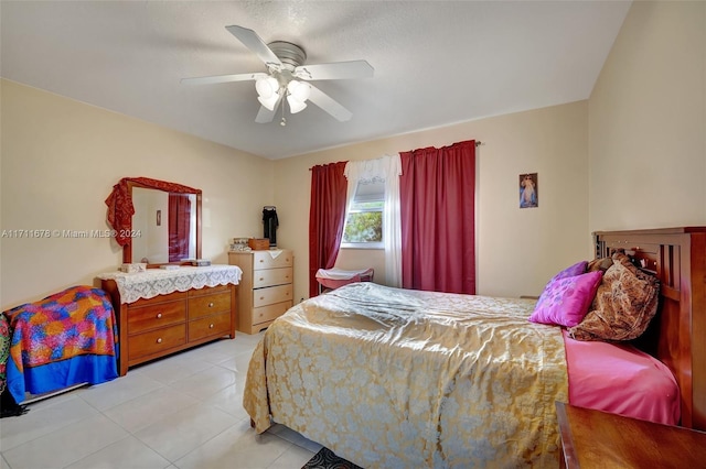 tiled bedroom with ceiling fan