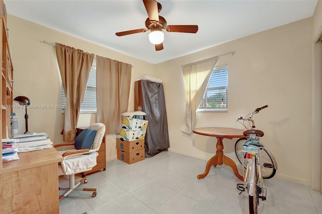 office space featuring light tile patterned floors and ceiling fan