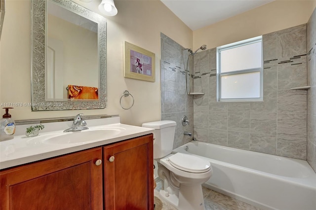 full bathroom featuring tile patterned floors, tiled shower / bath combo, toilet, and vanity