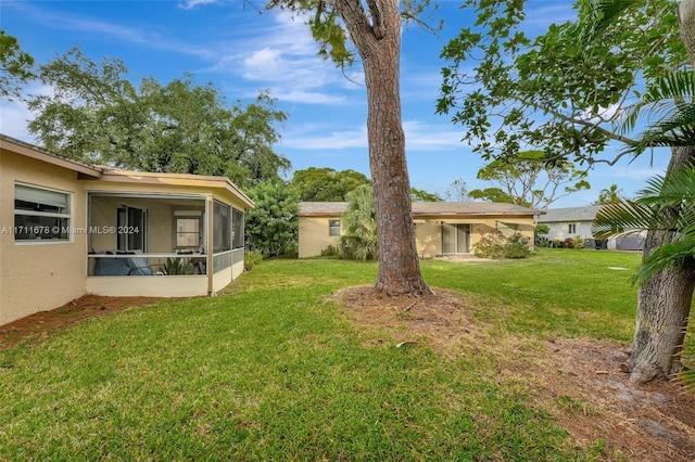 view of yard with a sunroom