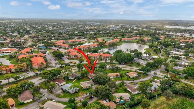 birds eye view of property featuring a water view