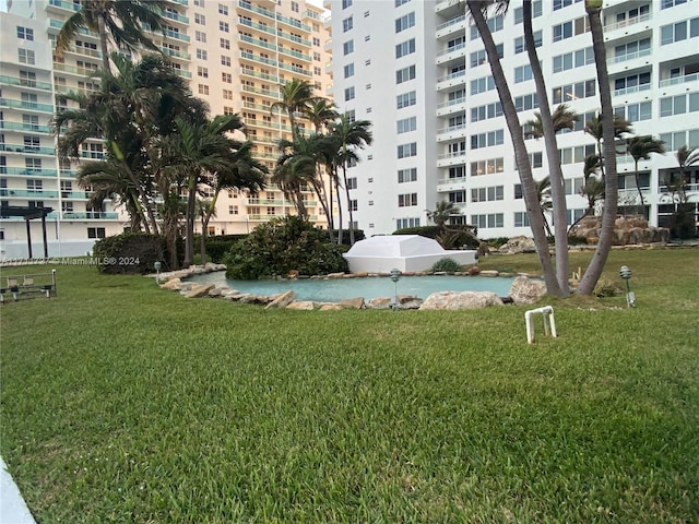 view of community featuring a lawn