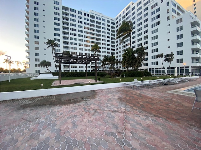 view of outdoor building at dusk