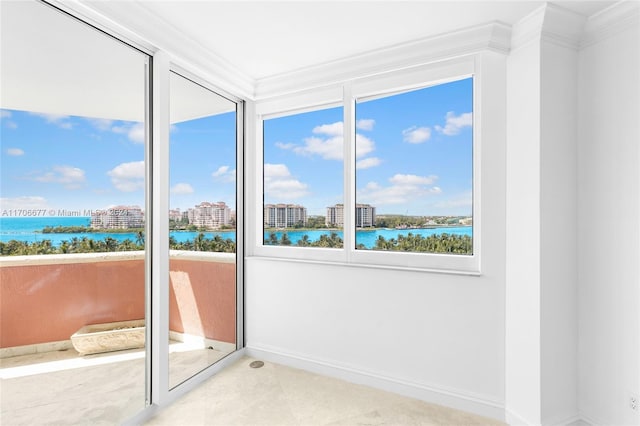 unfurnished sunroom with a water view