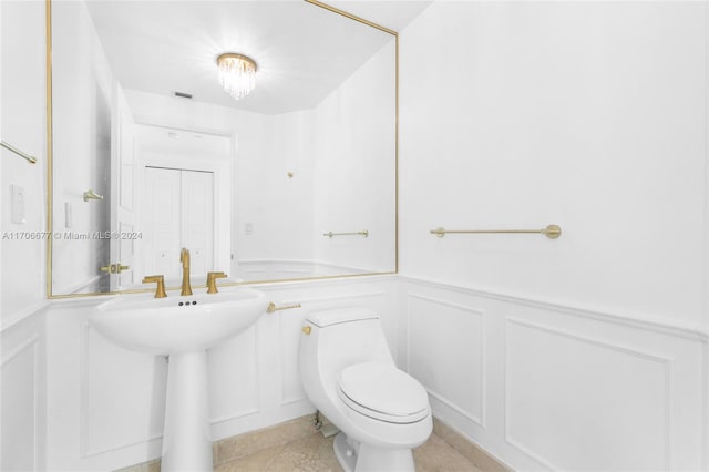 bathroom featuring tile patterned floors, sink, and toilet