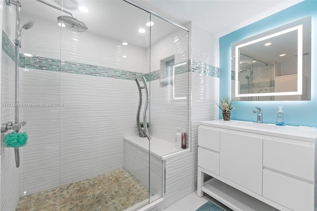 bathroom with vanity and an enclosed shower