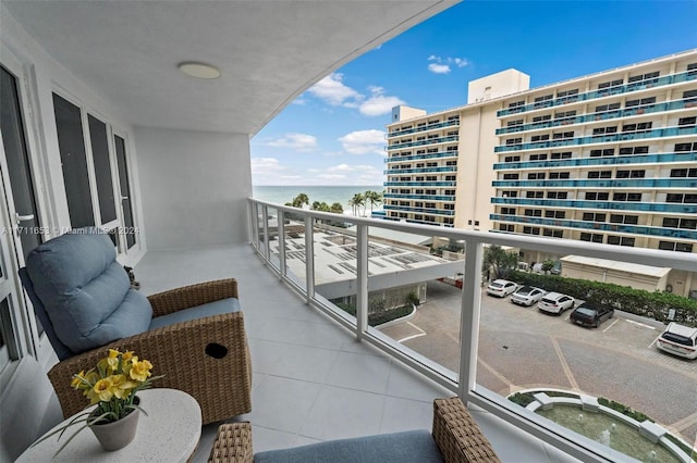 balcony featuring a water view