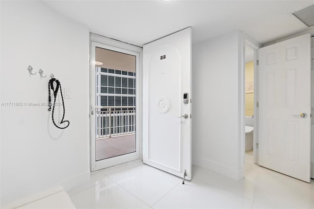 entryway featuring light tile patterned floors