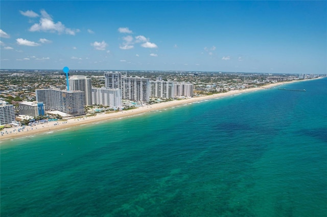 drone / aerial view featuring a view of the beach and a water view