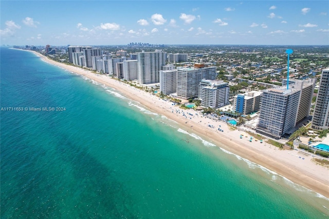 bird's eye view with a view of the beach and a water view