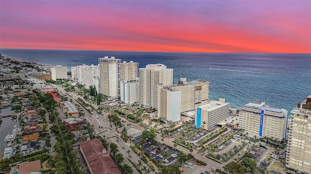 aerial view at dusk with a water view