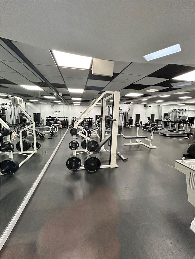 exercise room featuring a paneled ceiling