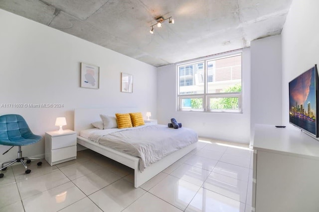 bedroom with light tile patterned flooring