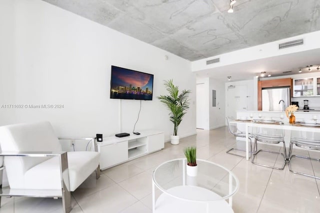 living room with light tile patterned floors