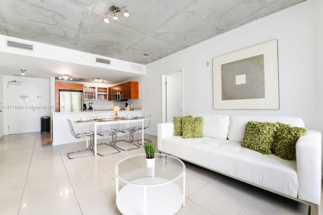 living room with light tile patterned floors