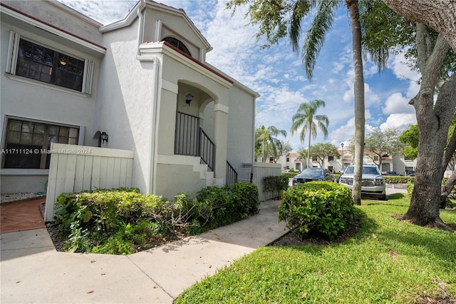 view of property exterior featuring a yard