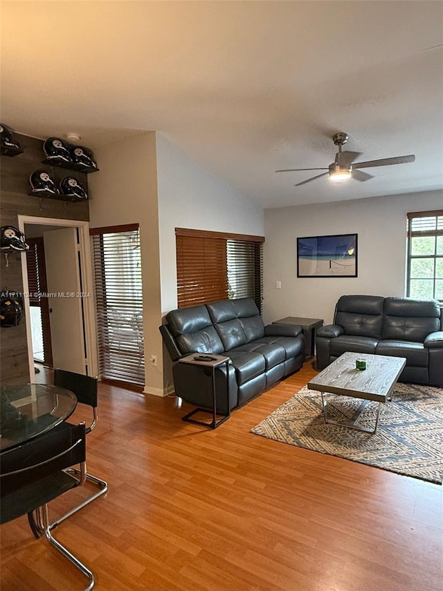 living room with ceiling fan and hardwood / wood-style floors