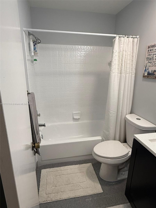 full bathroom featuring shower / bath combination with curtain, vanity, and toilet