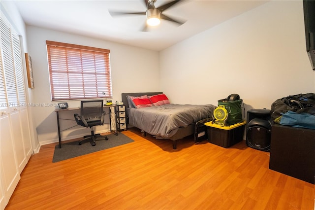 bedroom with ceiling fan and light wood-type flooring