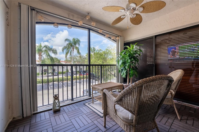 sunroom / solarium with ceiling fan