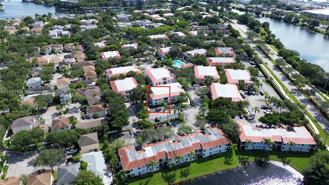 birds eye view of property with a water view