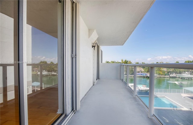 balcony featuring a water view