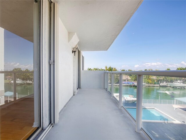balcony featuring a water view