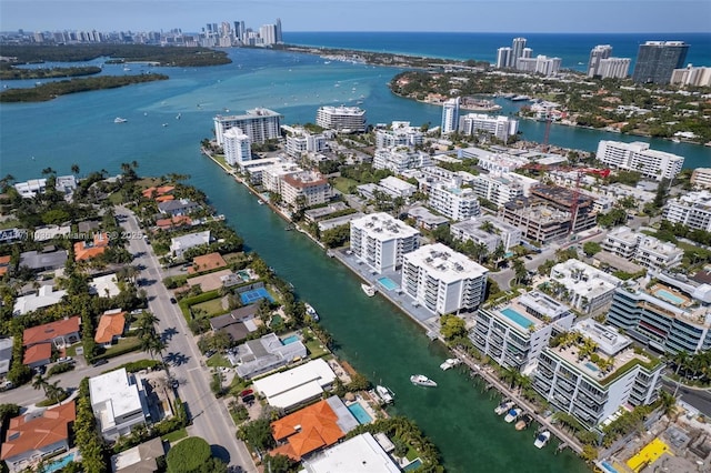 bird's eye view featuring a water view and a view of city