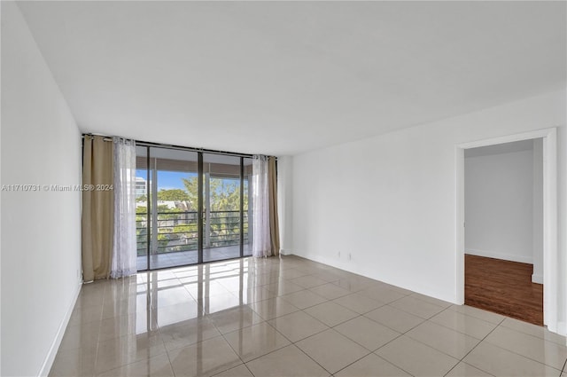 unfurnished room with light tile patterned floors